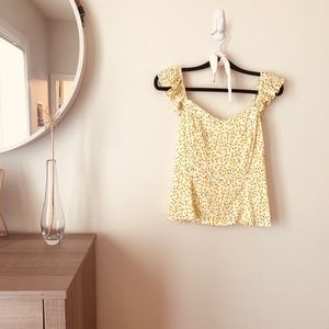 Ruffle trimmed top with yellow flowers